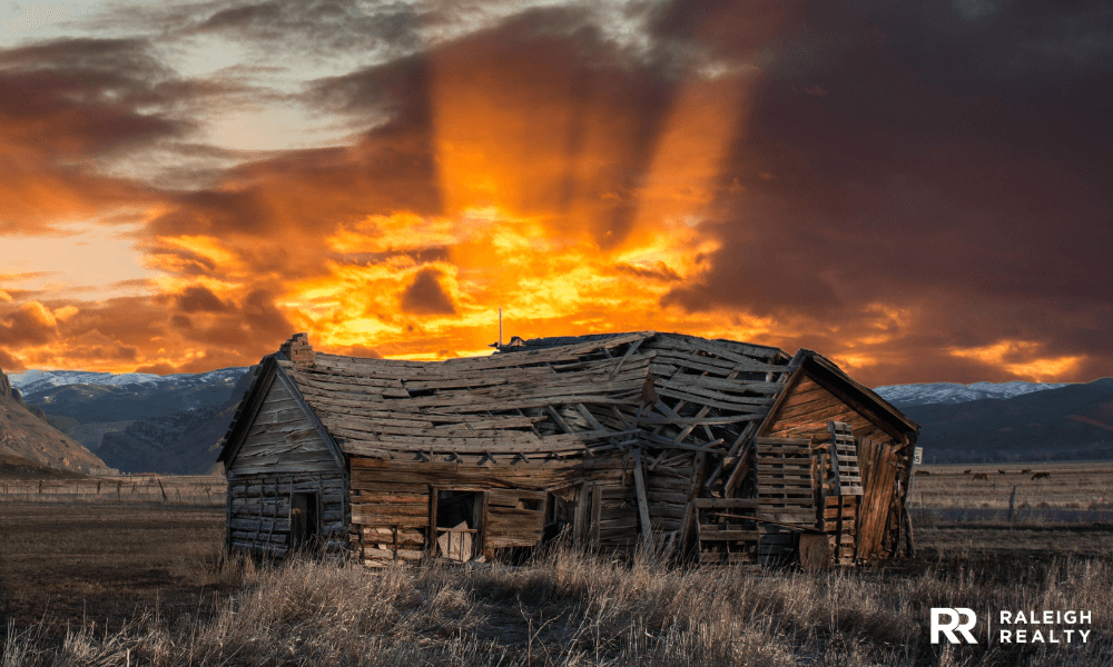 Home in bad condition in the mountains with sunset