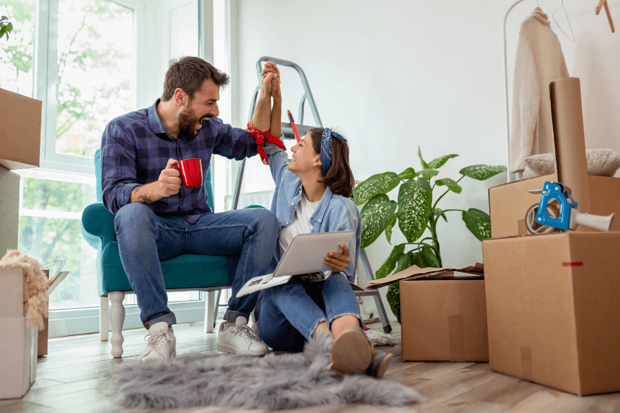 A couple celebrating as they continue to redecorate and create a new room