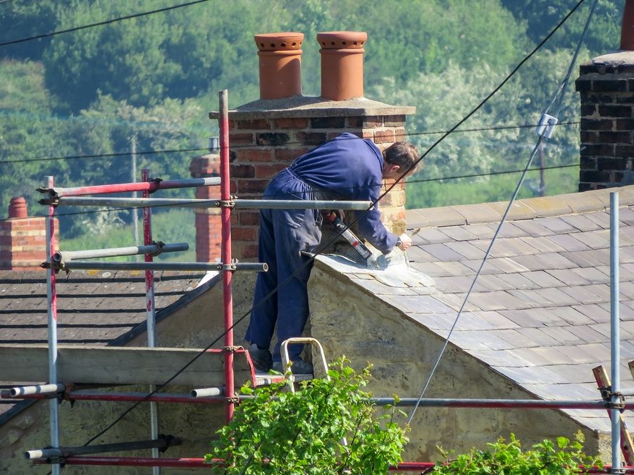 Roof needs repair when chimney flashings were damaged