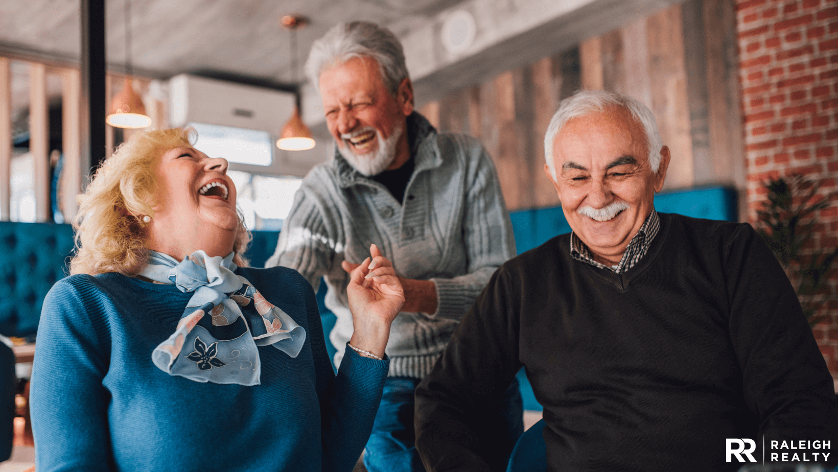 Seniors on the porch together sharing a laugh as they begin to age