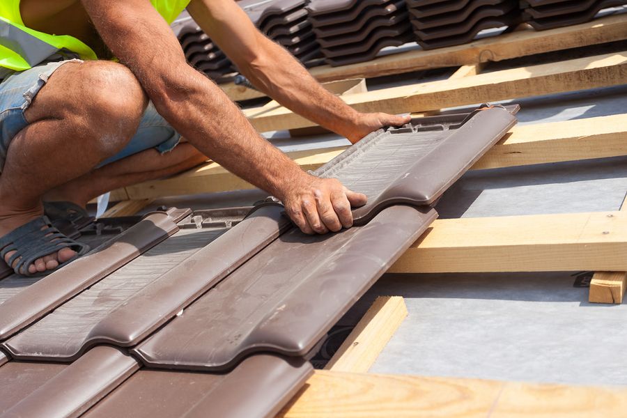 Tile Shingles being Installed on Roof