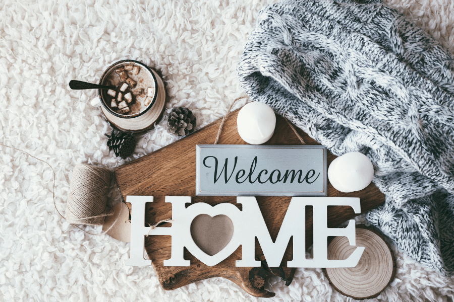 Welcome Home sign with other select pieces placed together for a stylish Instagram photo