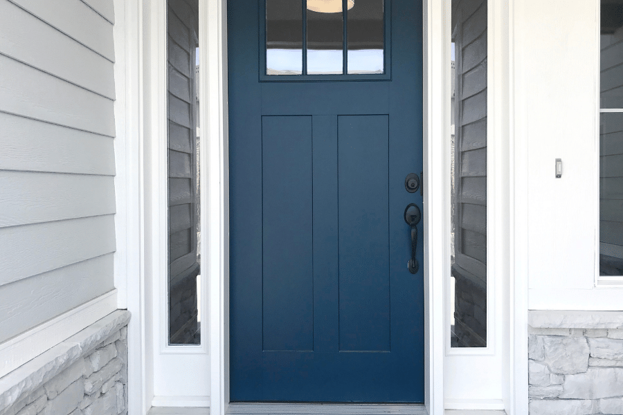 blue front door and grey house