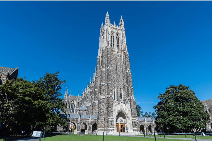 Duke Chapel on a sunny day surrounded by lush vegetation