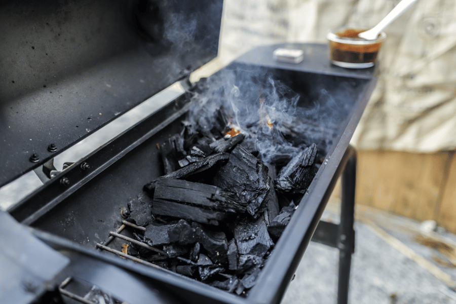 Hot charcoals inside of a charcoal grill 