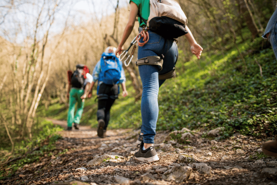 Hiking with gear and backpacks on a rocky trail