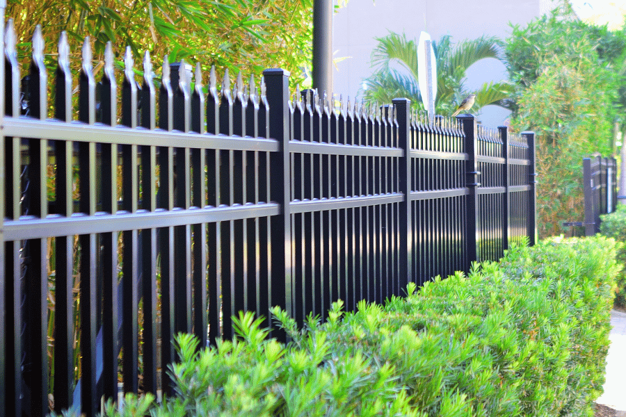 Black metal fence with gaps example