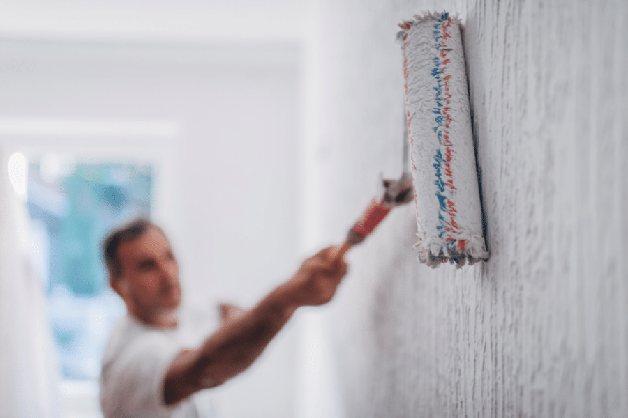 painting the wall white with a roller