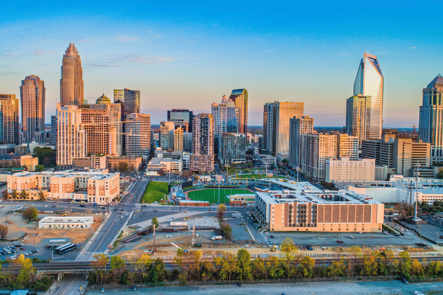 Downtown Charlotte view with field and buildings in background