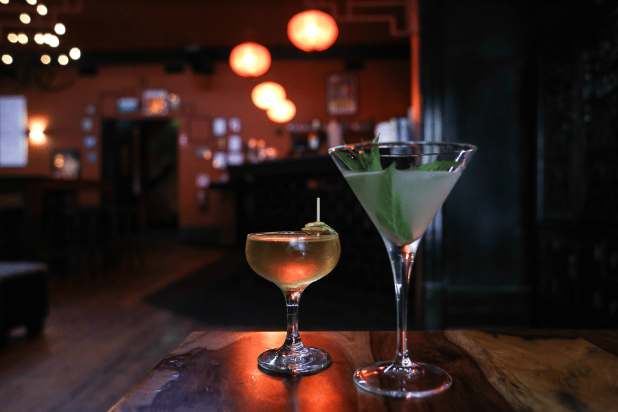 Order delicious cocktails at an intimate bar with a loved one 
