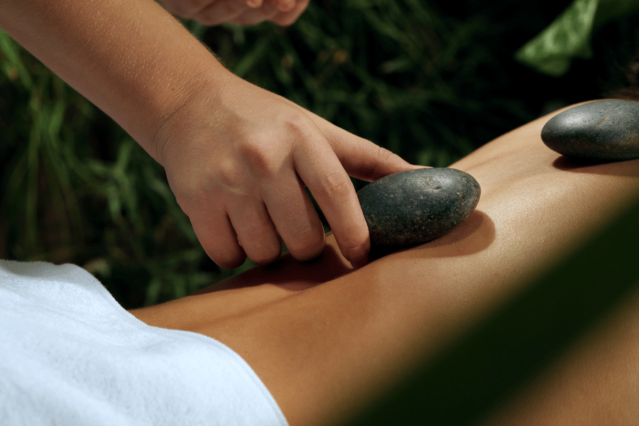 getting a hot stone massage at a day spa 