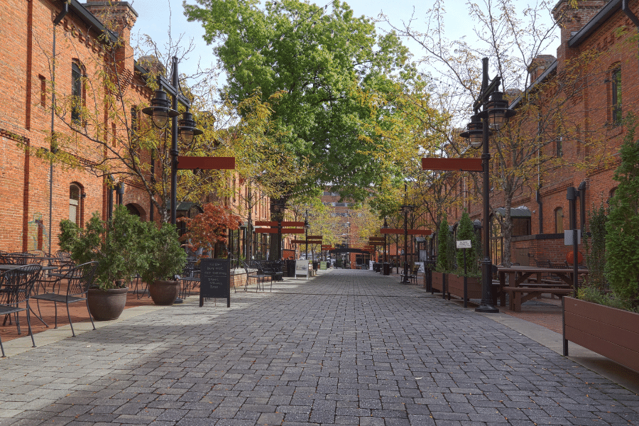 Old red brick tobacco warehouses that have been converted to retail shops in Durham, NC