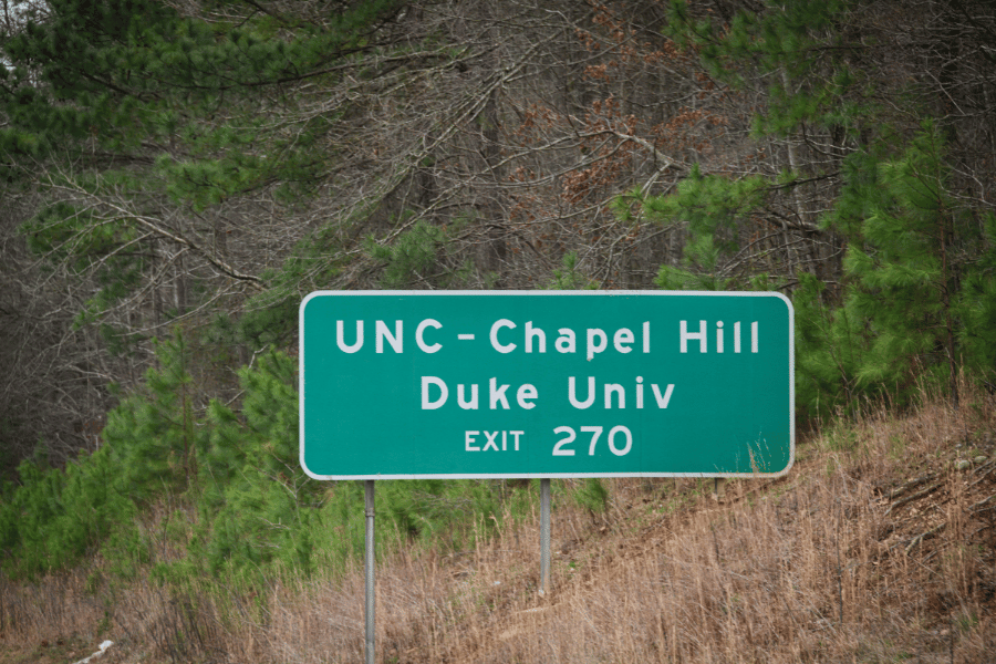 A sign showing distance to UNC Chapel Hill and Duke University