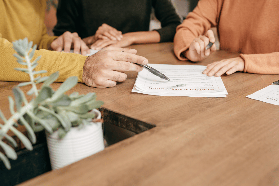 Home buyers looking over mortgage paperwork