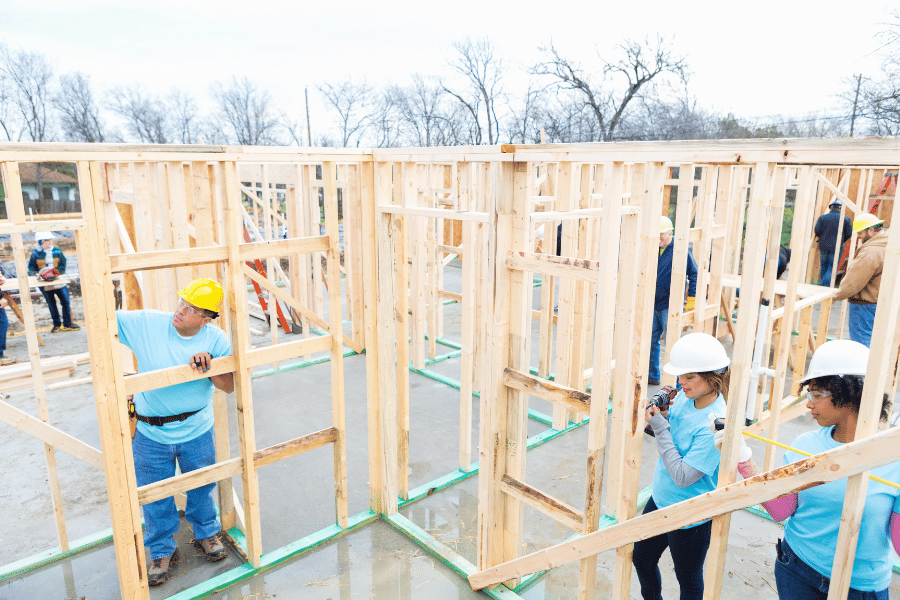 Habitat For Humanity volunteers framing a house 