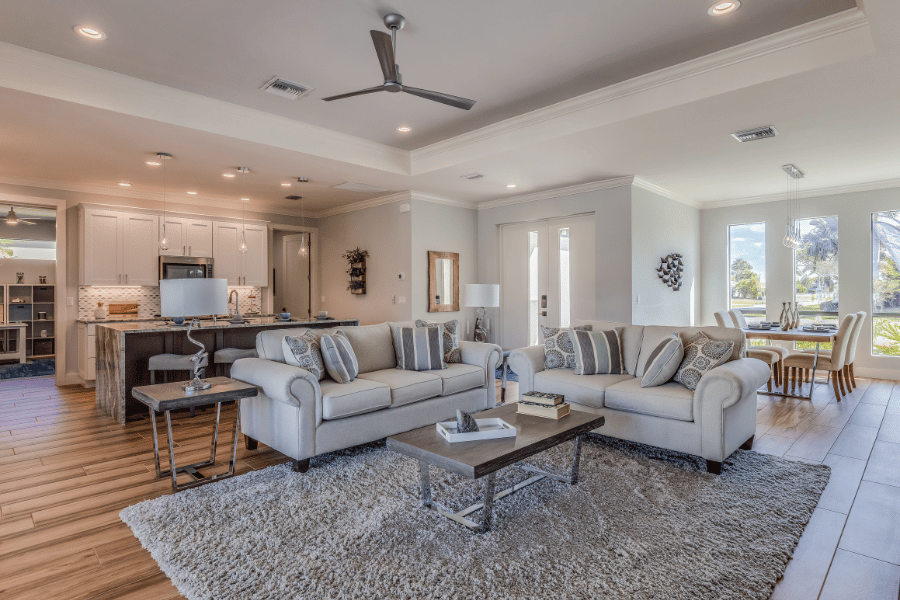 living room with two couches and a large area rug in an open floor plan