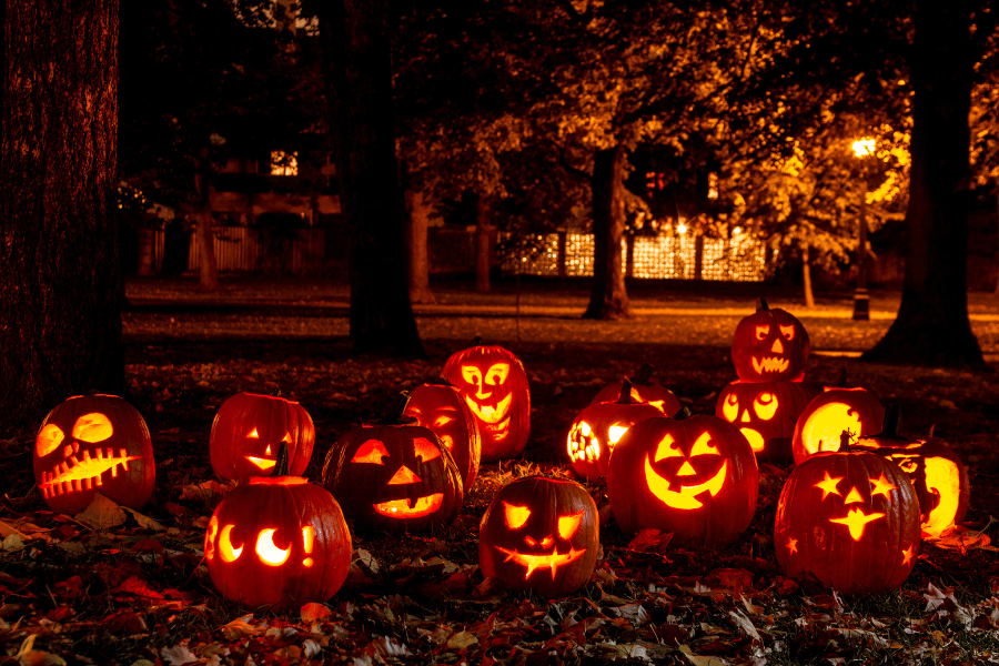 spooky carved pumpkins lit up on Halloween