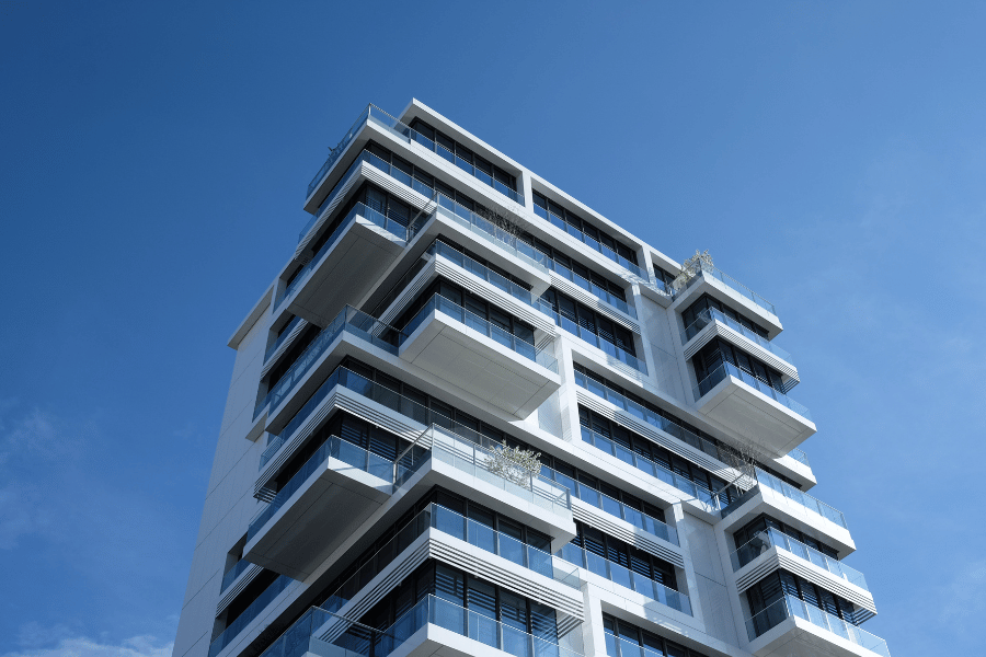 high rise condo in blue sky with balconies