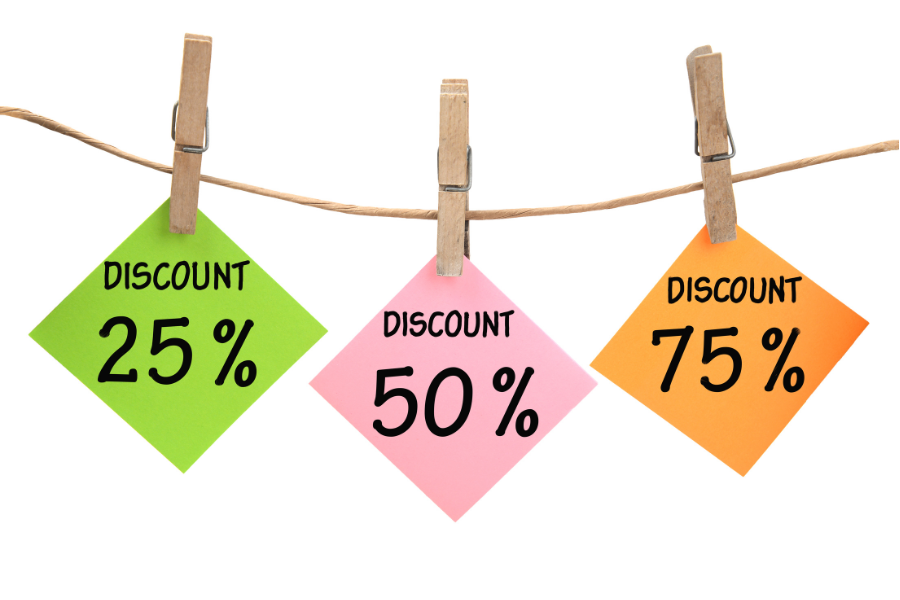 String with pink green and orange post it with 25% 50% 75% discount written on it