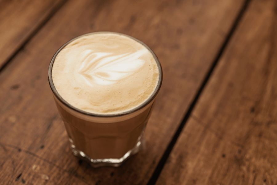 flat white coffee on a wood background
