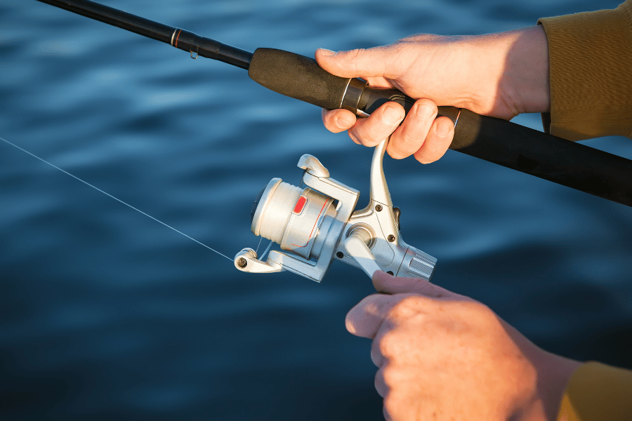 angler using a fishing rod and reel 