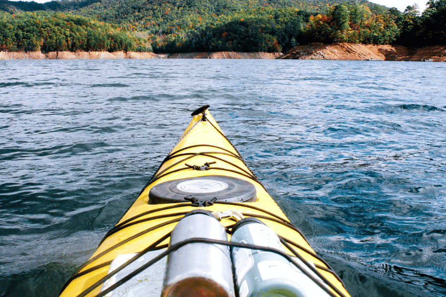 Canoeing in lake with views in mountains of NC