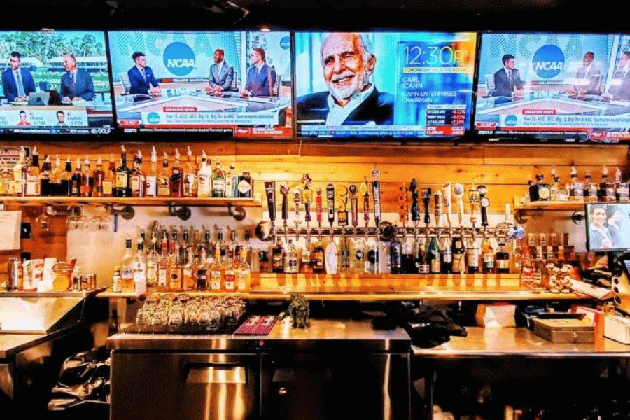 large tvs at a bar