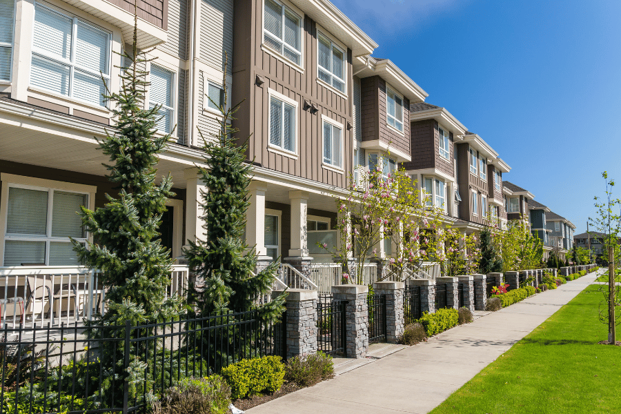 Apartment Buildings with front porches and beautiful landscaping 