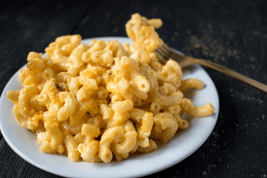 bowl of macaroni and cheese with a fork