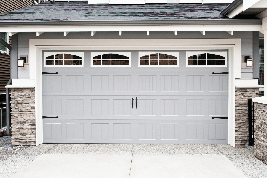 Garage Door on a home with windows and black features