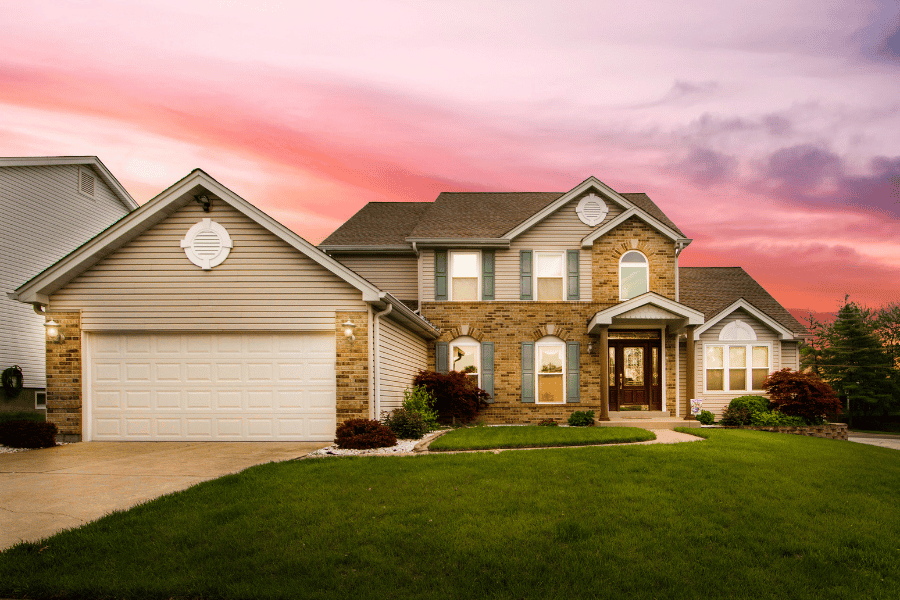 beautiful single-family home with pink sunset 