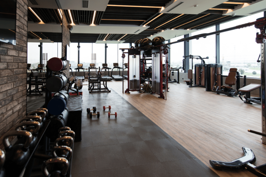 fitness center with weights and equipment
