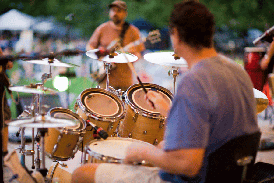 enjoy live music at an outdoor concert on a summer date