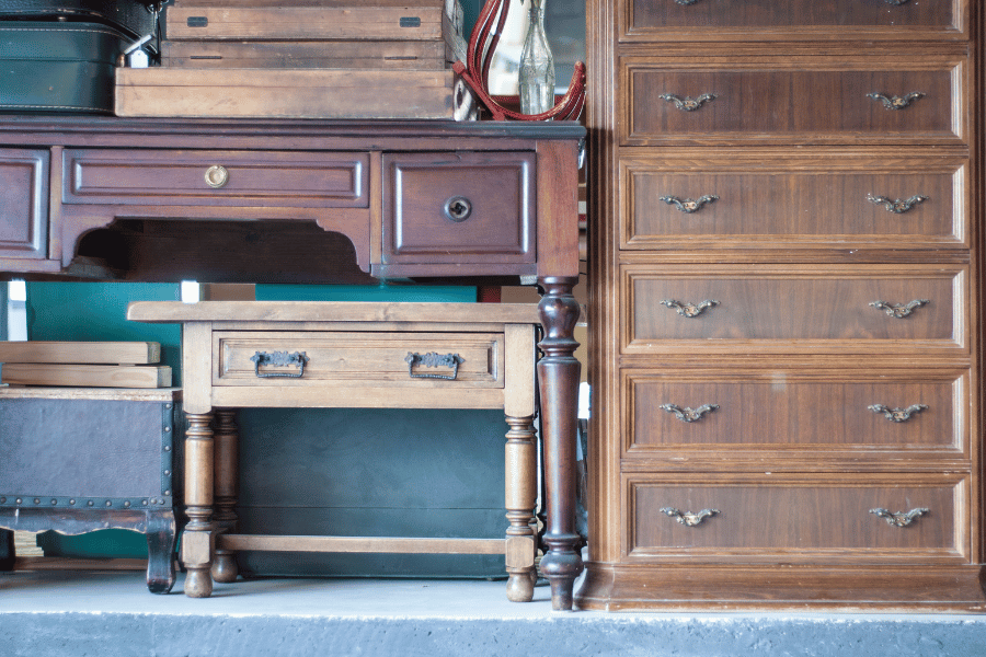 Old and antique furniture stacked near each other 