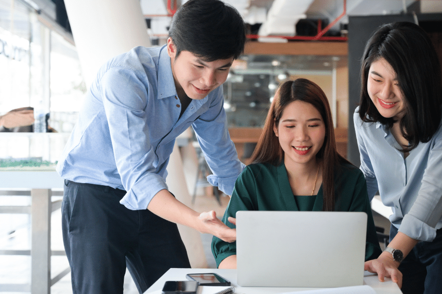 People talking and working on a computer