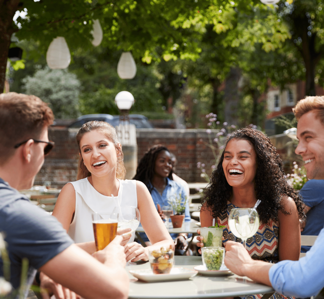 Millennials at the brewery with drinks having a conversation