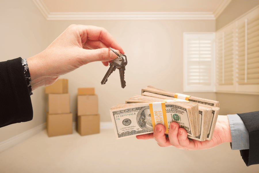 buying a house with cash and receiving the home keys 