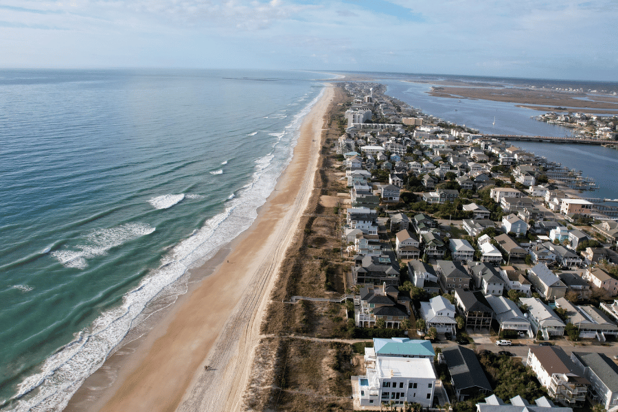 Wilmington, NC coastline with beautiful beach and beach homes