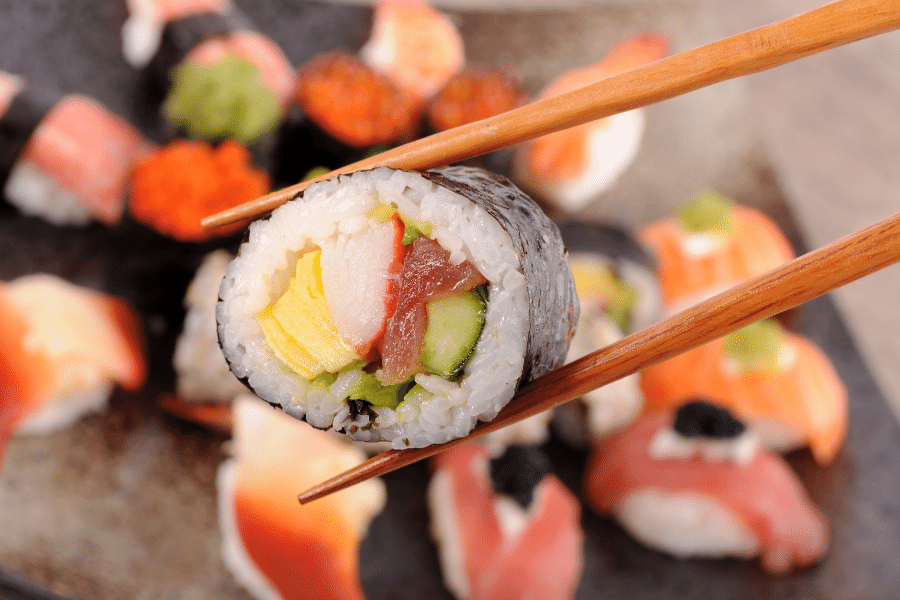 Sushi in chop sticks