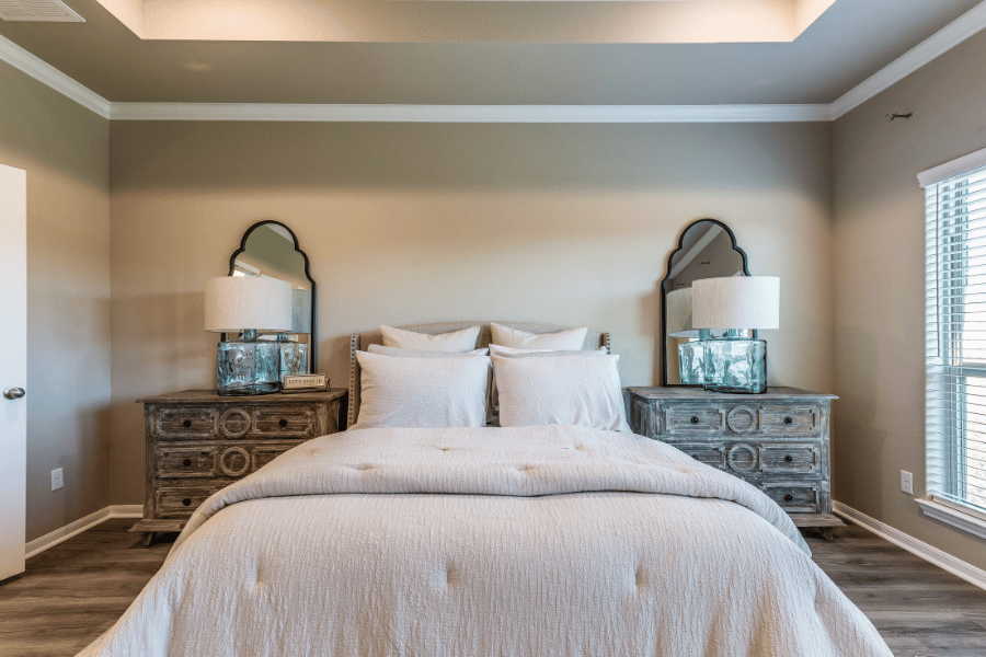 Staged bedroom with bed and nightstands
