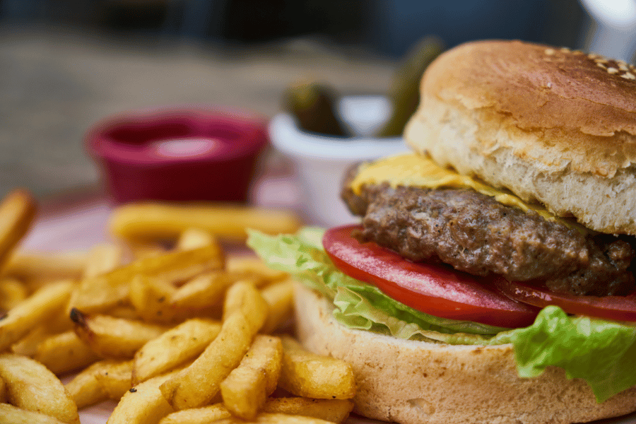 Enjoy a cheesburger and fries at Aviator Smokehouse