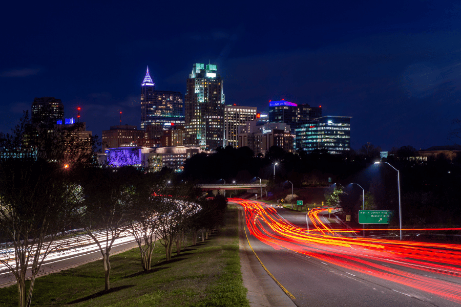 Driving in Raleigh city view with lights at night time