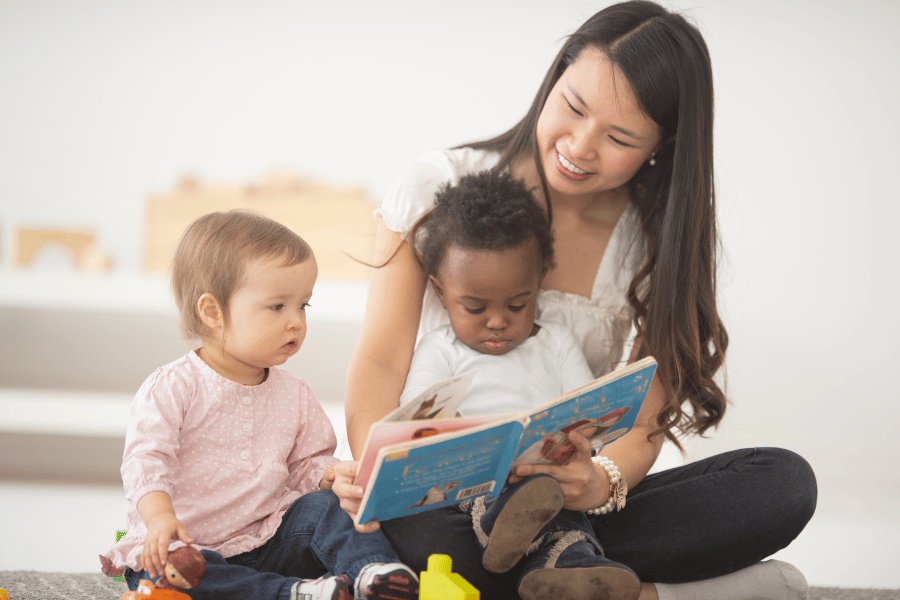 daycare working reading book to kids 