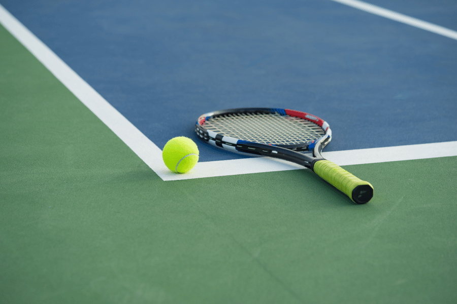 Tennis racket on a tennis court 