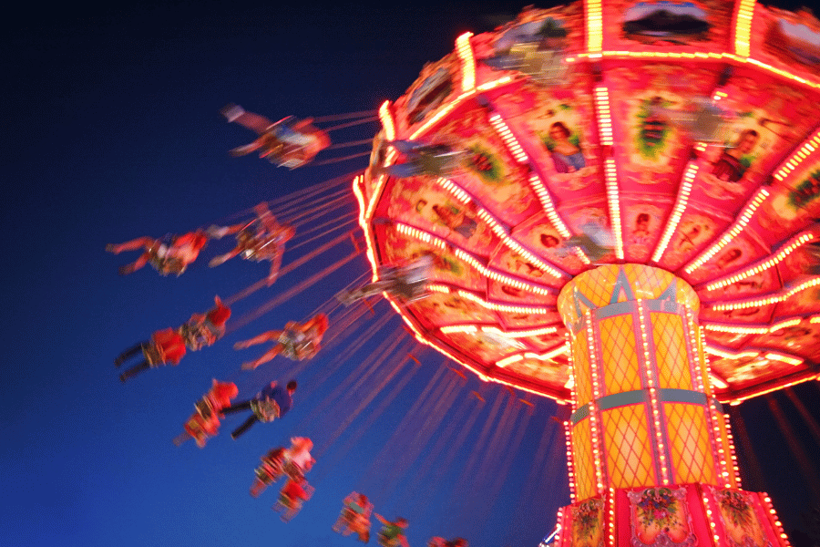 high-flying swings at the state fair at night