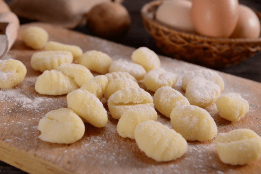 freshly made gnocchi on a wood board 