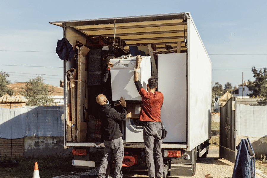 team of local movers loading up a moving truck