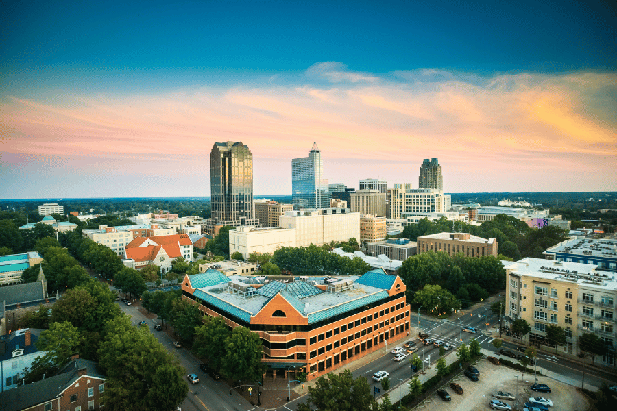 City of Raleigh skyline with tall buildings and cars
