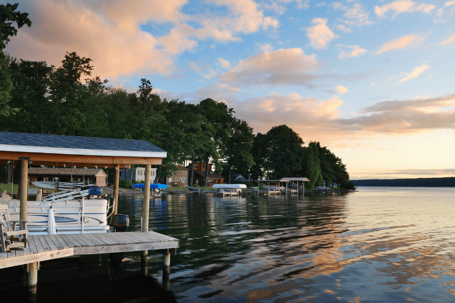 Lakehouse view with sunset in the back and boats