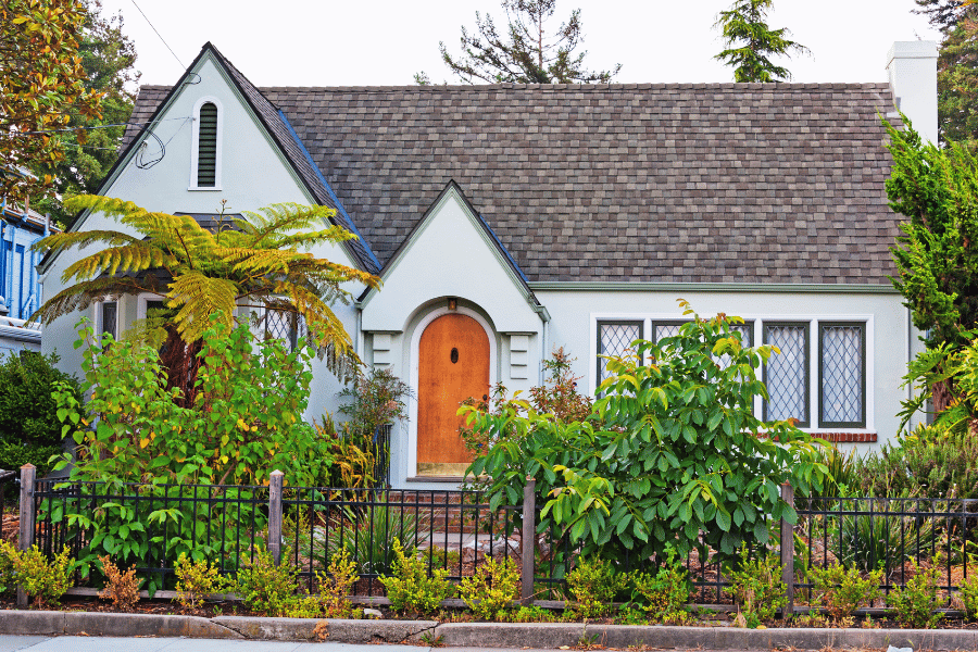 cottage with greenery and a wooden door